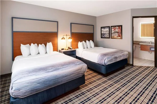 AmericInn by Wyndham Crookston — double-queen guestroom