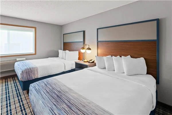 AmericInn by Wyndham Crookston — double-queen guestroom, alternate view