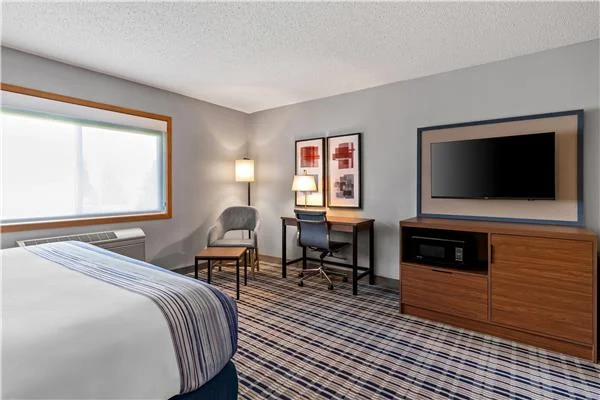 AmericInn by Wyndham Crookston — TV unit, desk and side table