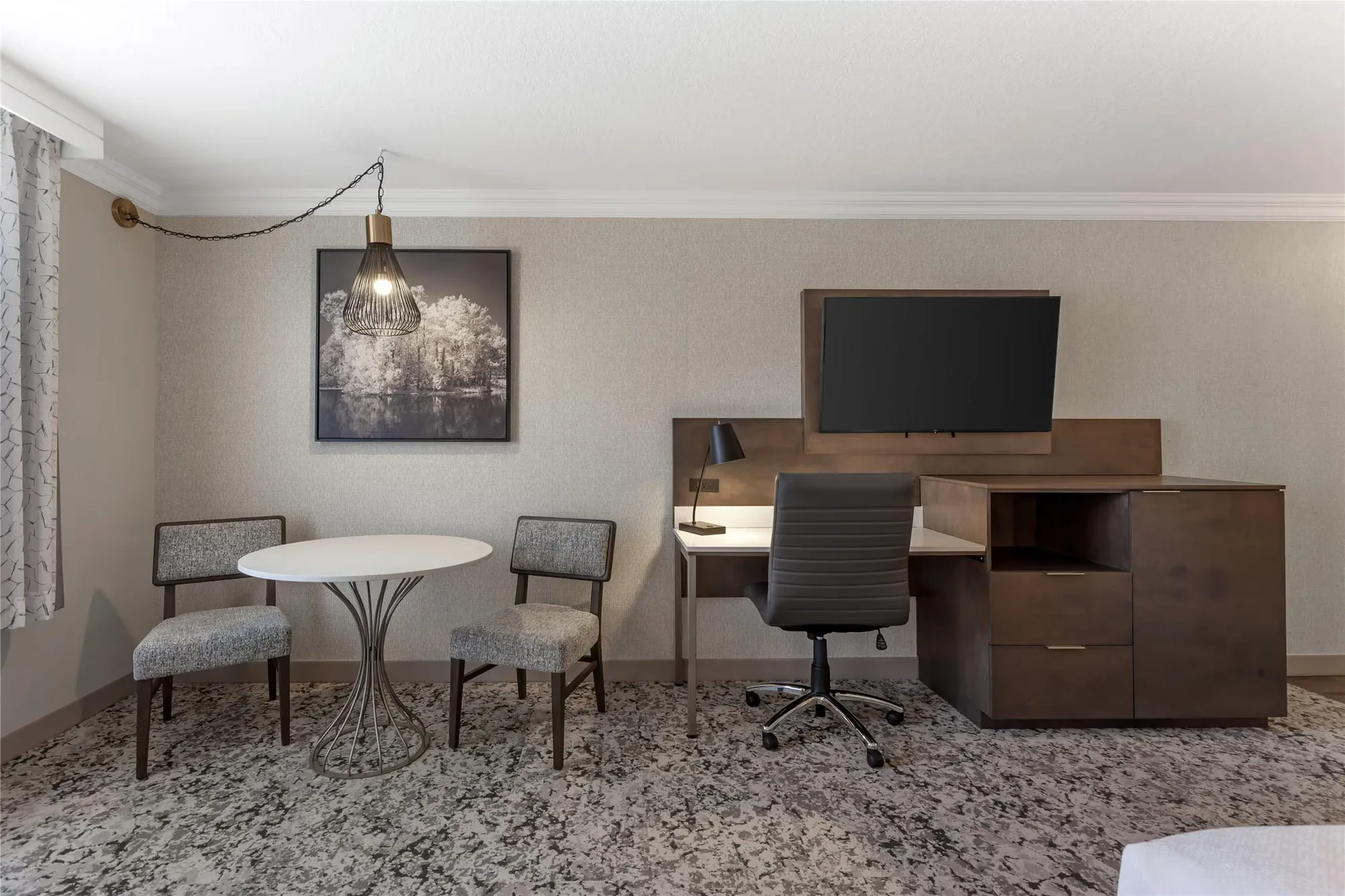 Best Western Plus The Arden Park Hotel — desk and TV console with drawer storage, dining table and upholstered chairs