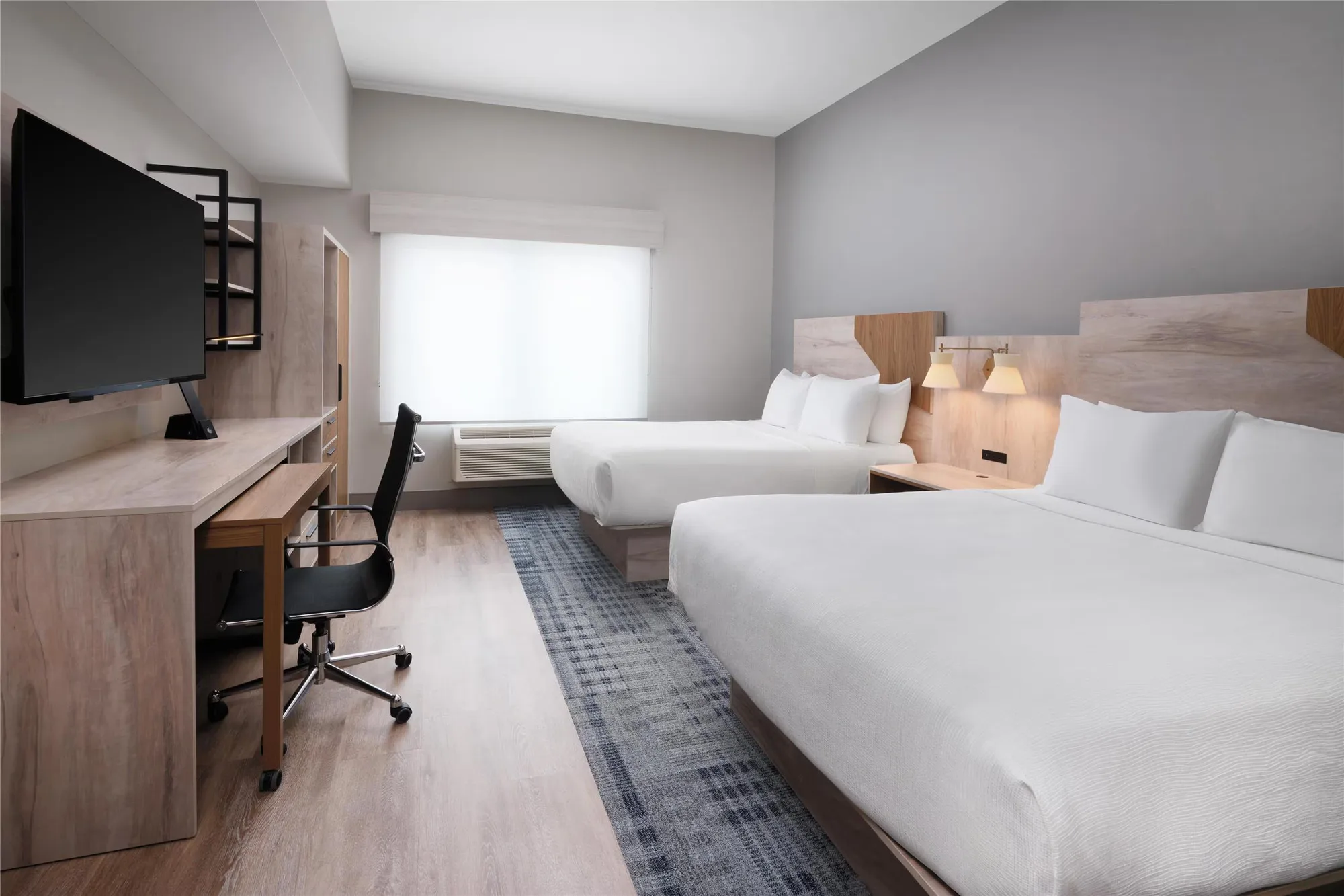 Branded hotel guestroom furnished with Nerval FF&E case goods