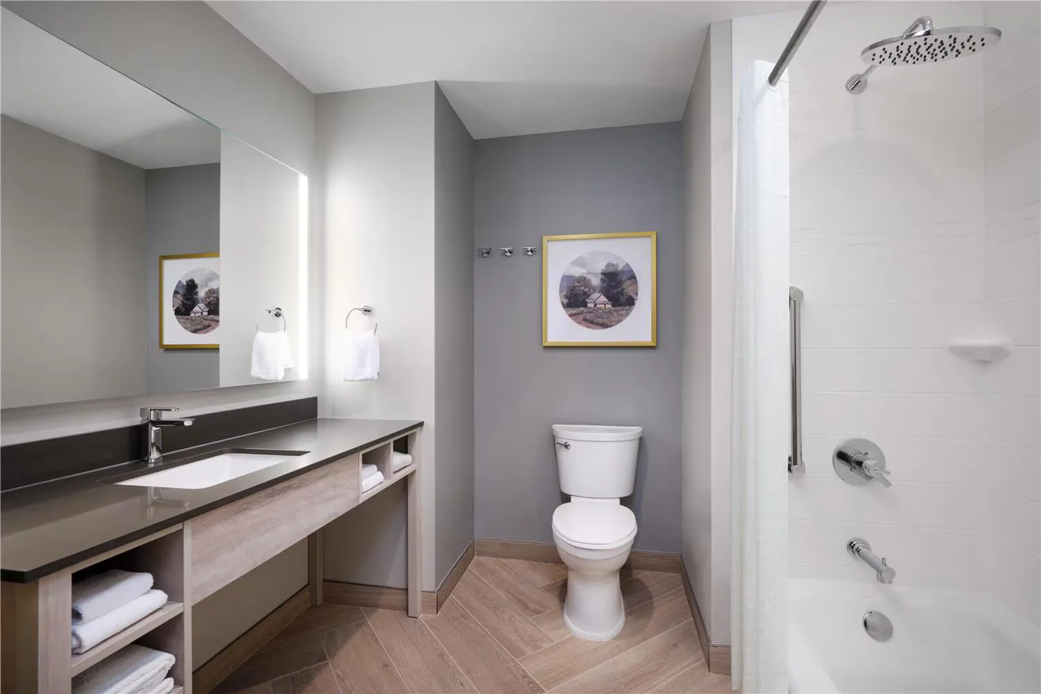 @HOME by Best Western Walkerton — bathroom vanity with stone top, undermount basin and open towel storage