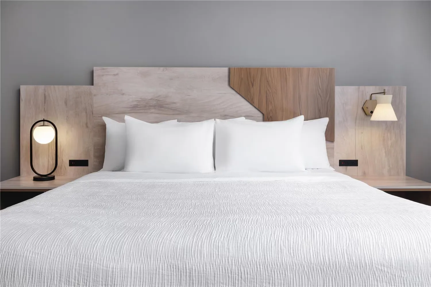 @HOME by Best Western Walkerton — king headboard with integrated reading lights and floating nightstands