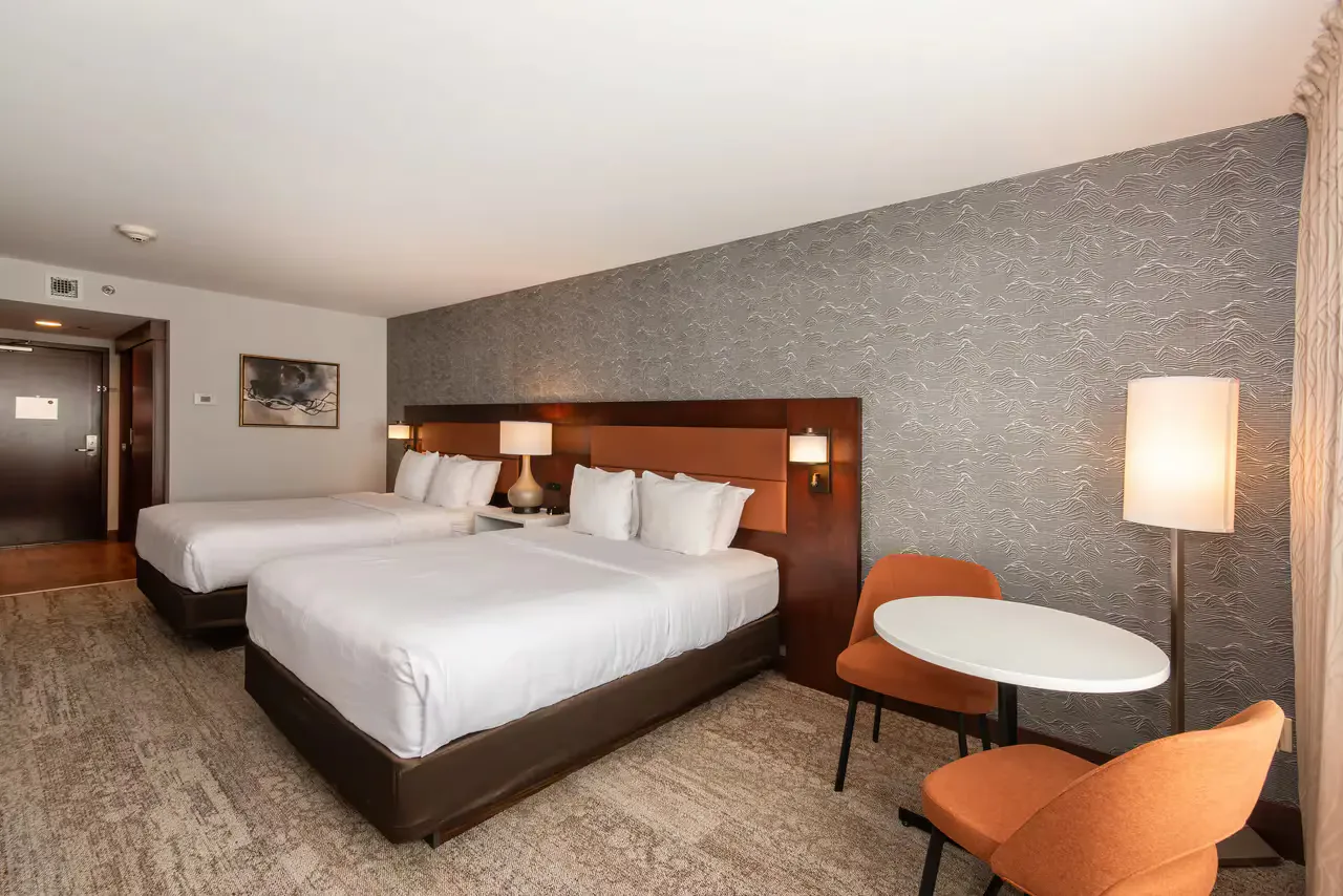 Quality Inn & Suites guestroom — view 2