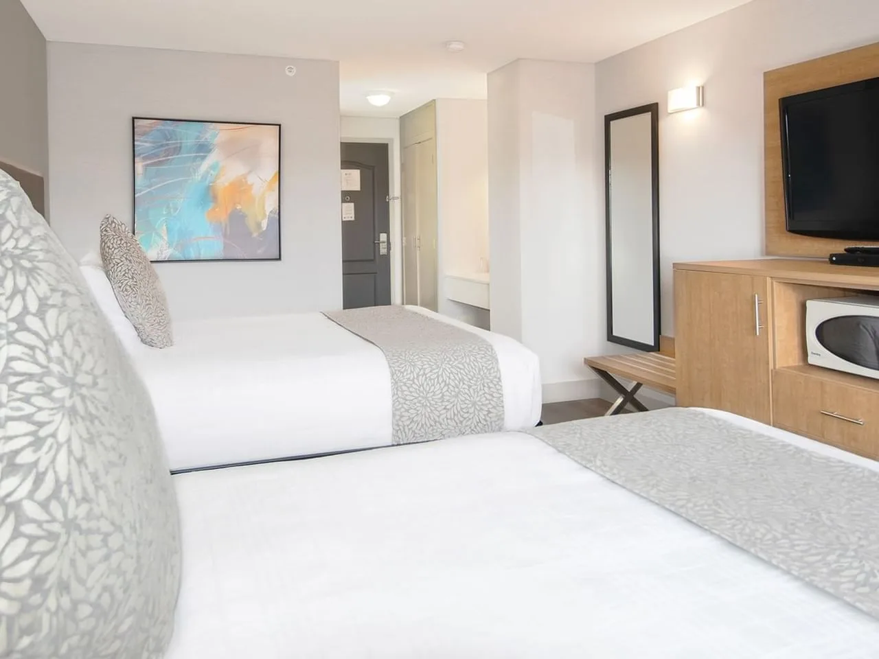 Coast Hotels guestroom — Coast Abbotsford Hotel & Suites, Abbotsford BC · Artwork & Mirrors