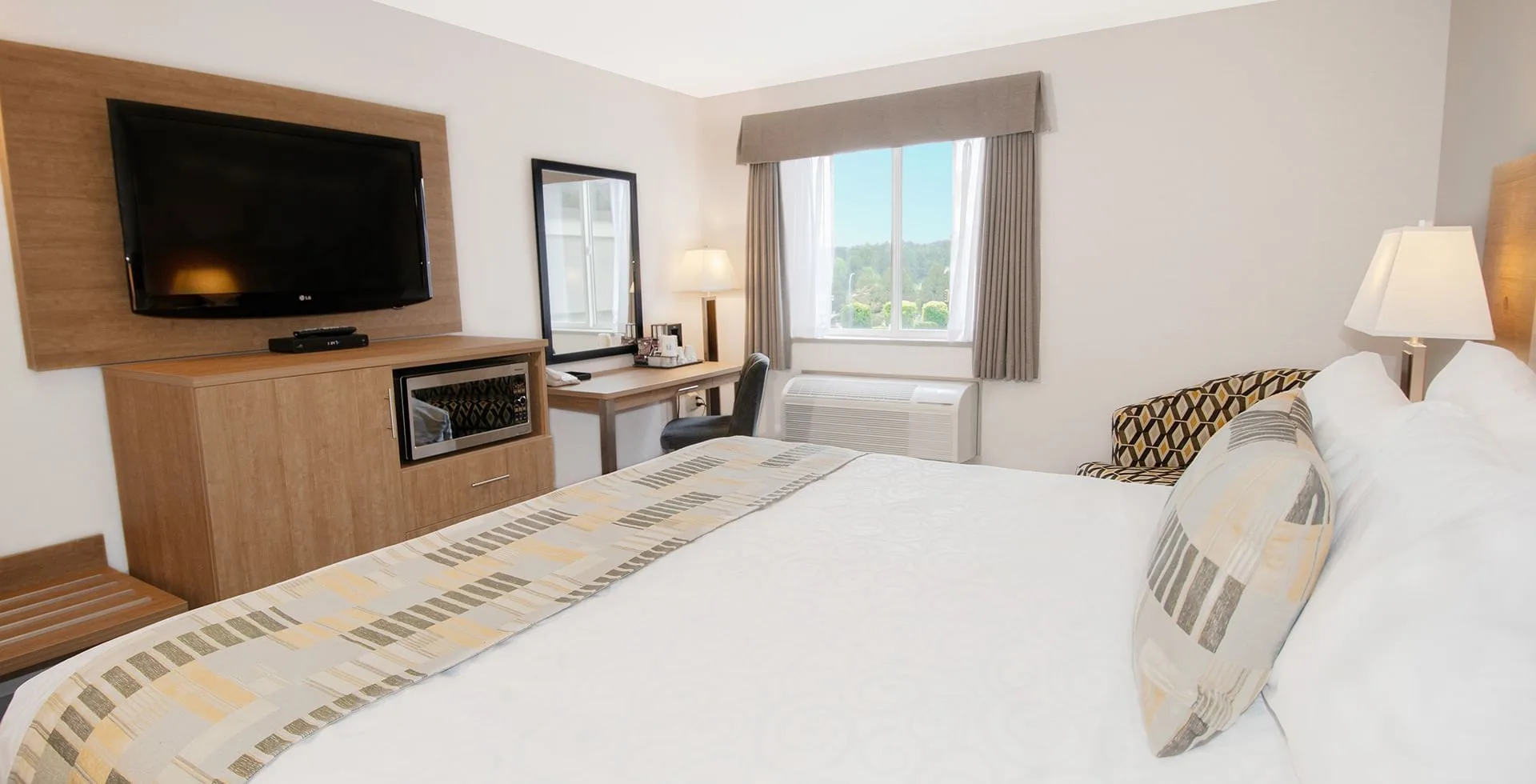 Coast Hotels guestroom — Coast Abbotsford Hotel & Suites, Abbotsford BC · Desk, Credenza & Mirror