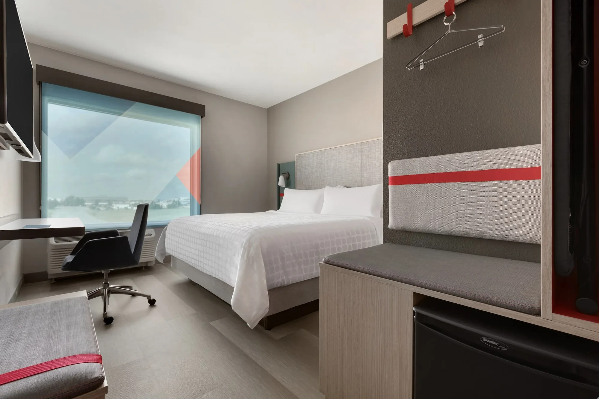 Avid Hotels guestroom — view 1