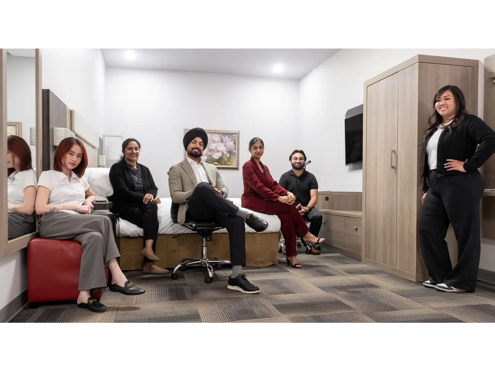 The Nerval FF&E team in a hotel guestroom set at the Sherwood Park facility